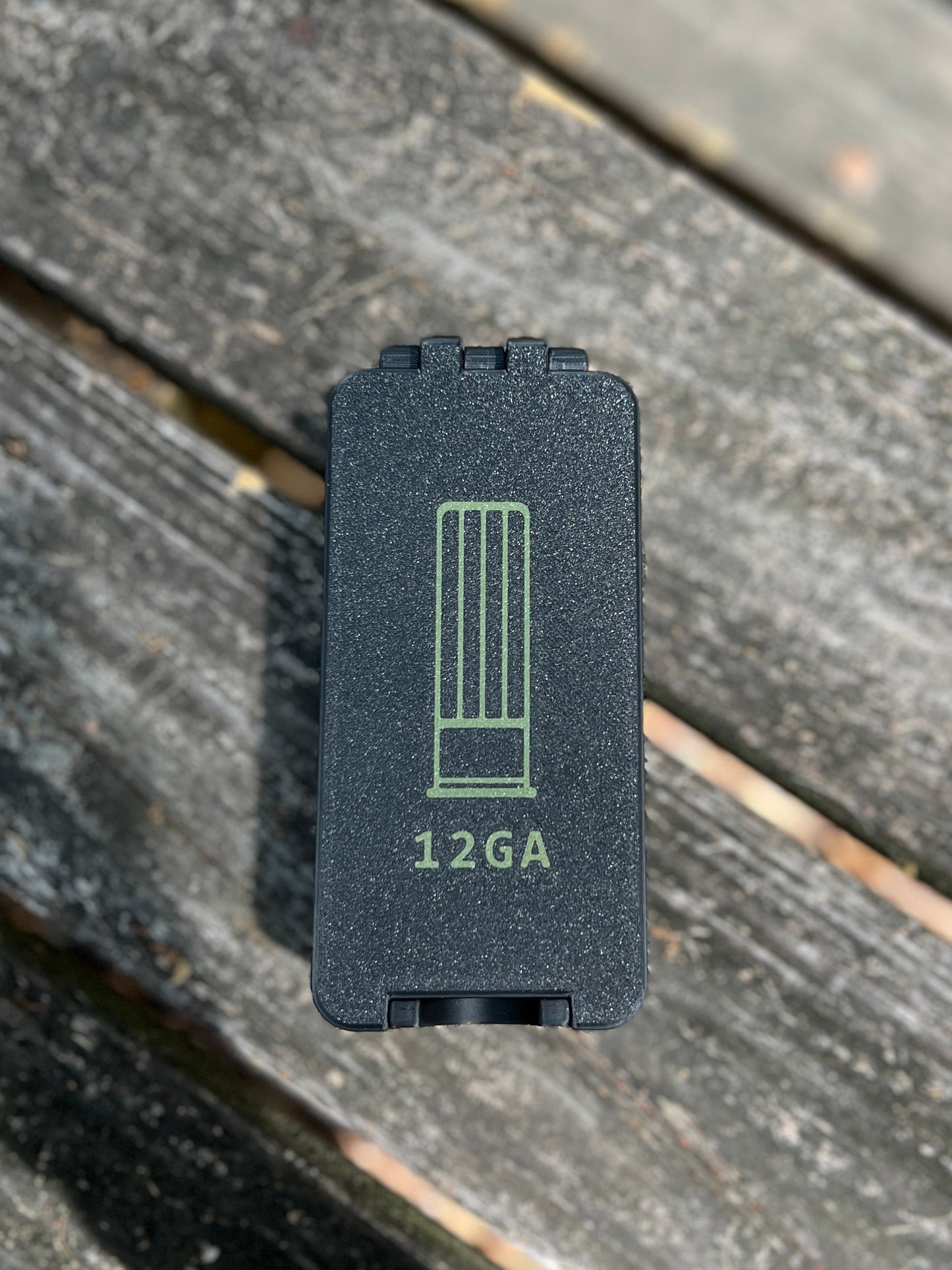 Black 12 gauge ammo storage with label