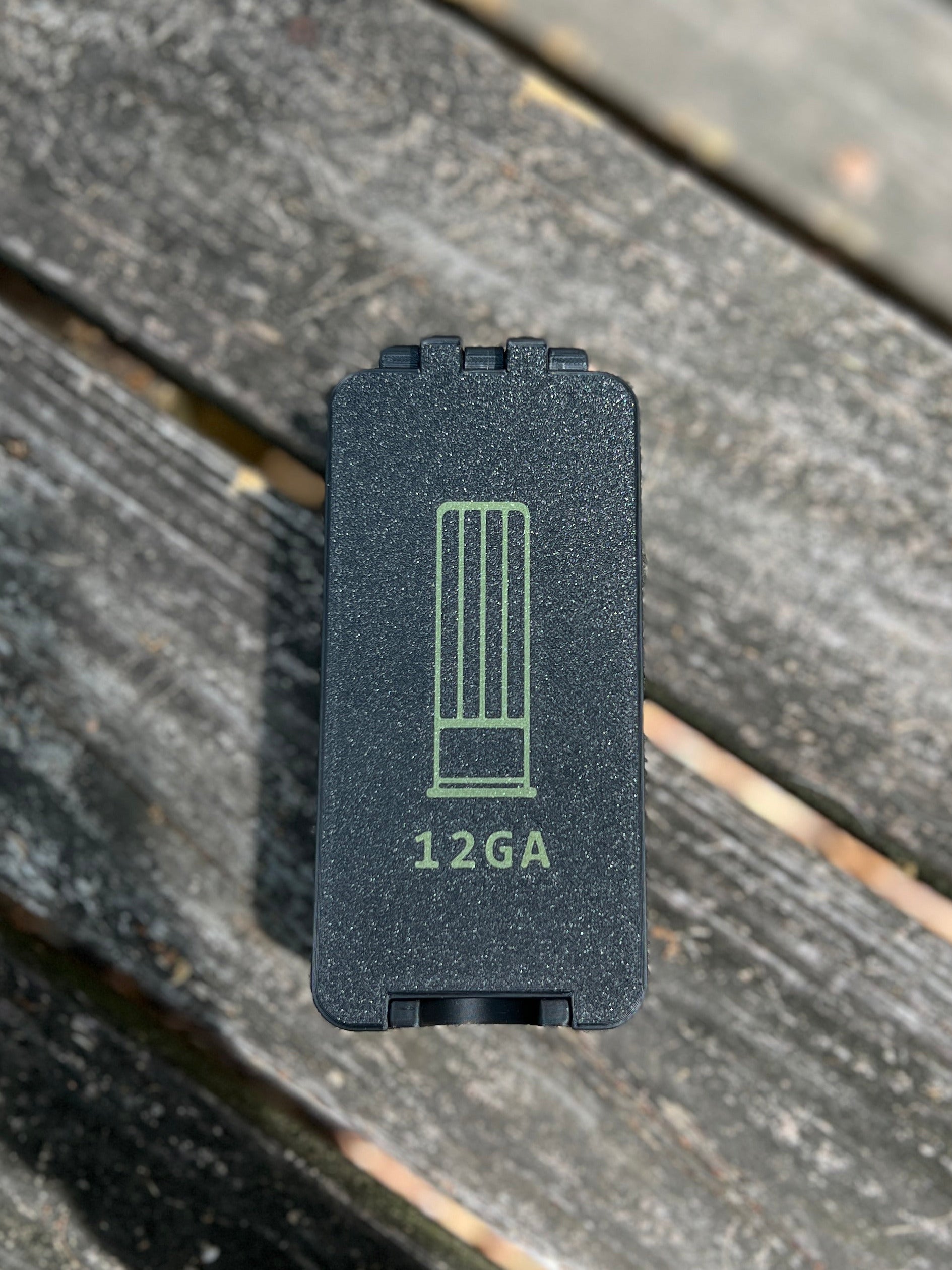 Black 12 gauge ammo storage with label